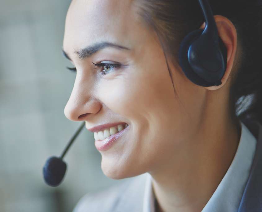smiling-executive-using-headset